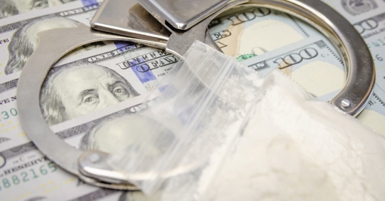 money, handcuffs, drugs